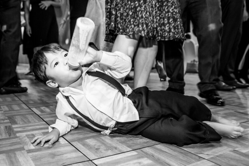 Ring Bearer parties with his milk on dance floor