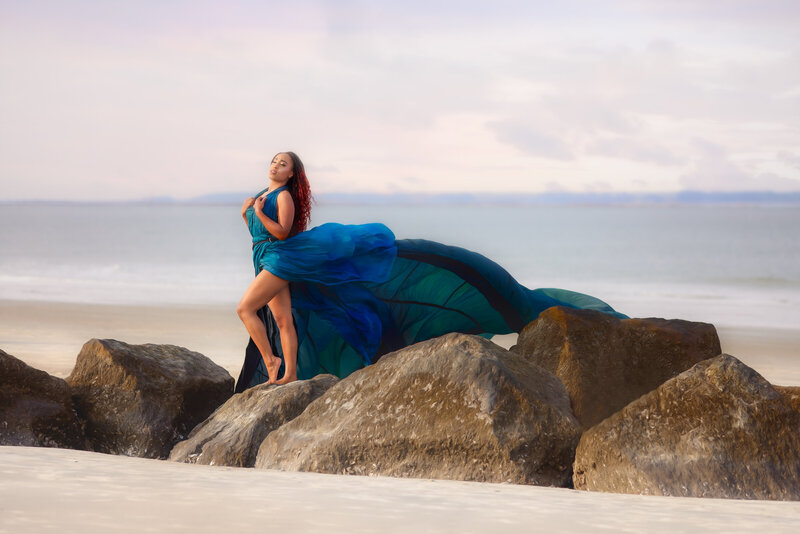 Savannah Georgia Boudoir and Glamour Woman in blue parachute gown on beach and rocks