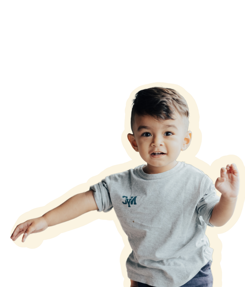 Young Latin boy engaged in a nurturing early learning environment at an early childhood education center in East Dallas, TX.