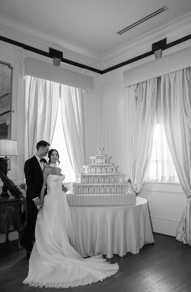 bride and groom embracing in orchard