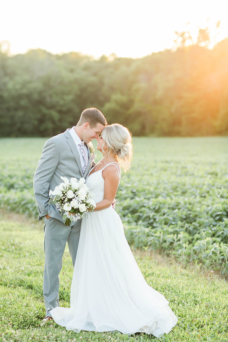 Bride and Groom kissing on wedding day at Encore Hall in Berlin Ohio