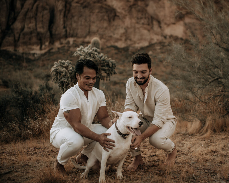 engagement session with dog in all white outfits at the superstition mountains