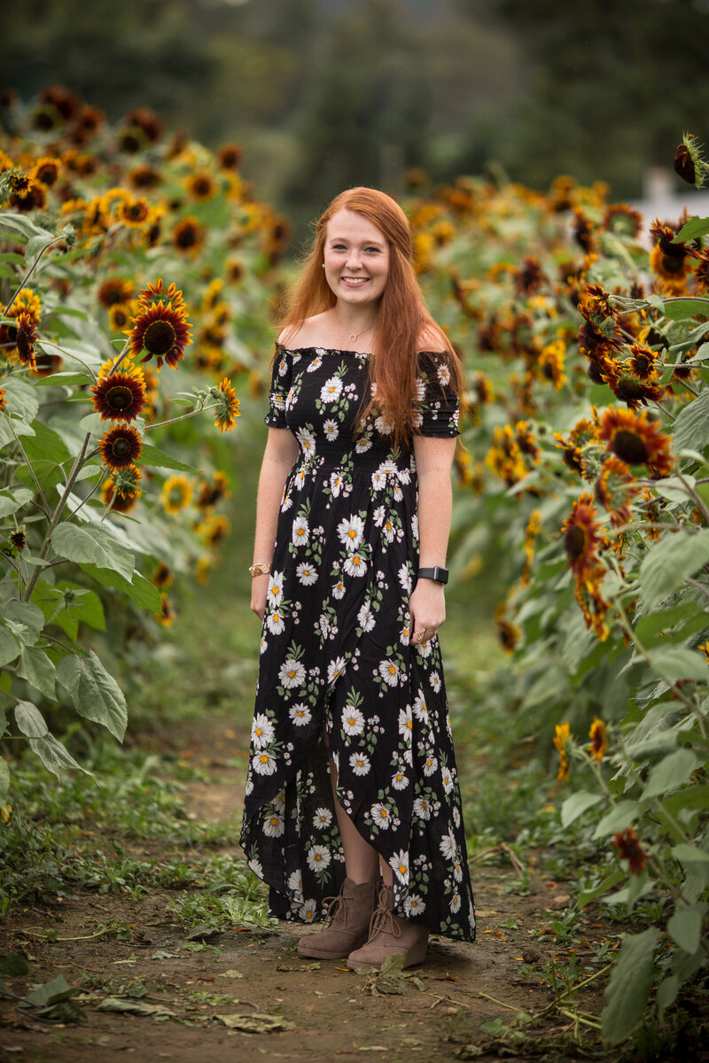 Senior portrait in a sunflower field