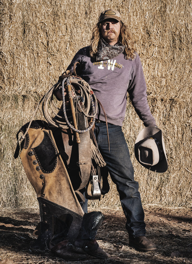 Cowboy Holding His Hat and Saddle, From The Lore Of The Range Collection