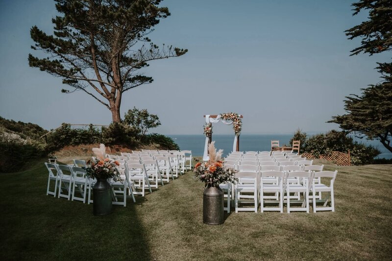 A wedding ceremony setup in front of the fort with views of the sea