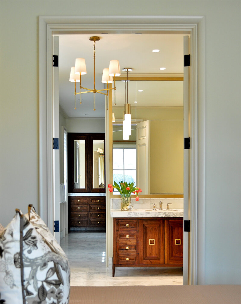 Image of stately master bath with traditional southern accents including antique cabinetry for sinks