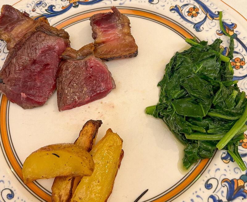 Steak and veggie sides at L'Antica Trattoria in Como, Italy