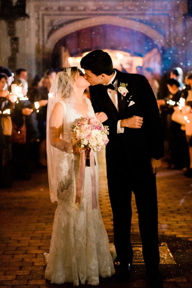 evening wedding ceremony at graham chapel washington university with sparklers in st louis missouri