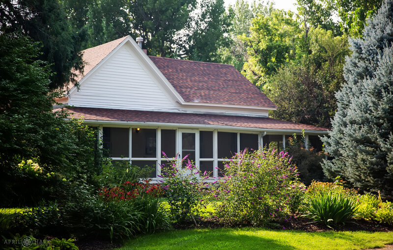 Side view of the Polly Steele Nature Center farmhouse at a wedding at Chatfield Farms