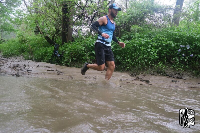 Dan runnging through the muddy water