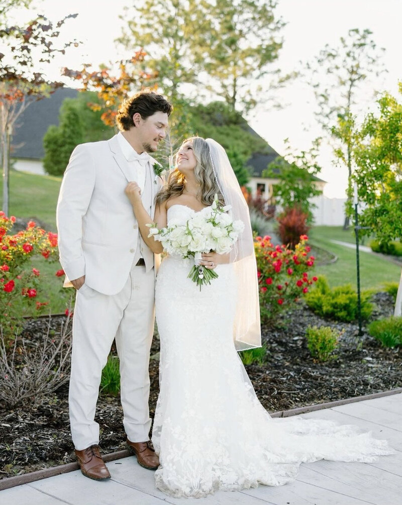 Married couple standing and staring each other outdoors