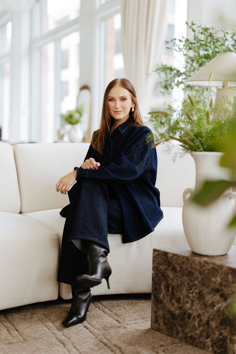 Photo of the founder and creative director of The Studio Chicago sitting in one of her studio rental spaces.