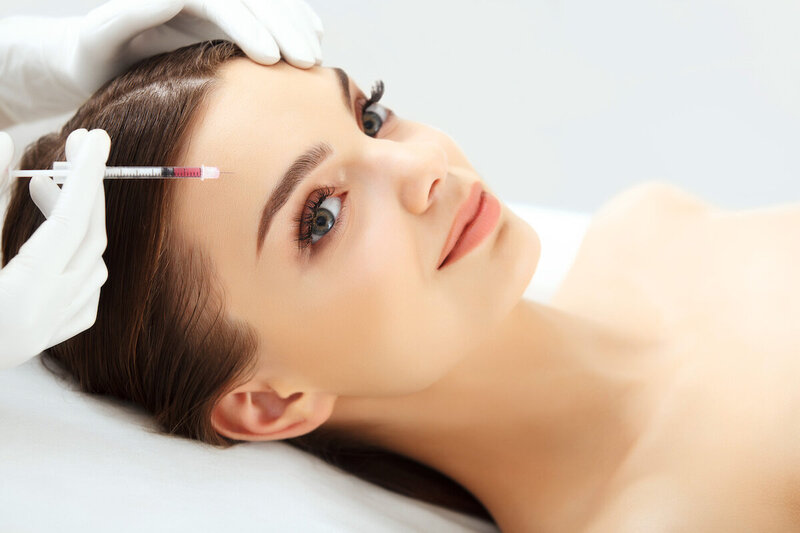 woman receiving botox wrinkle softener treatment