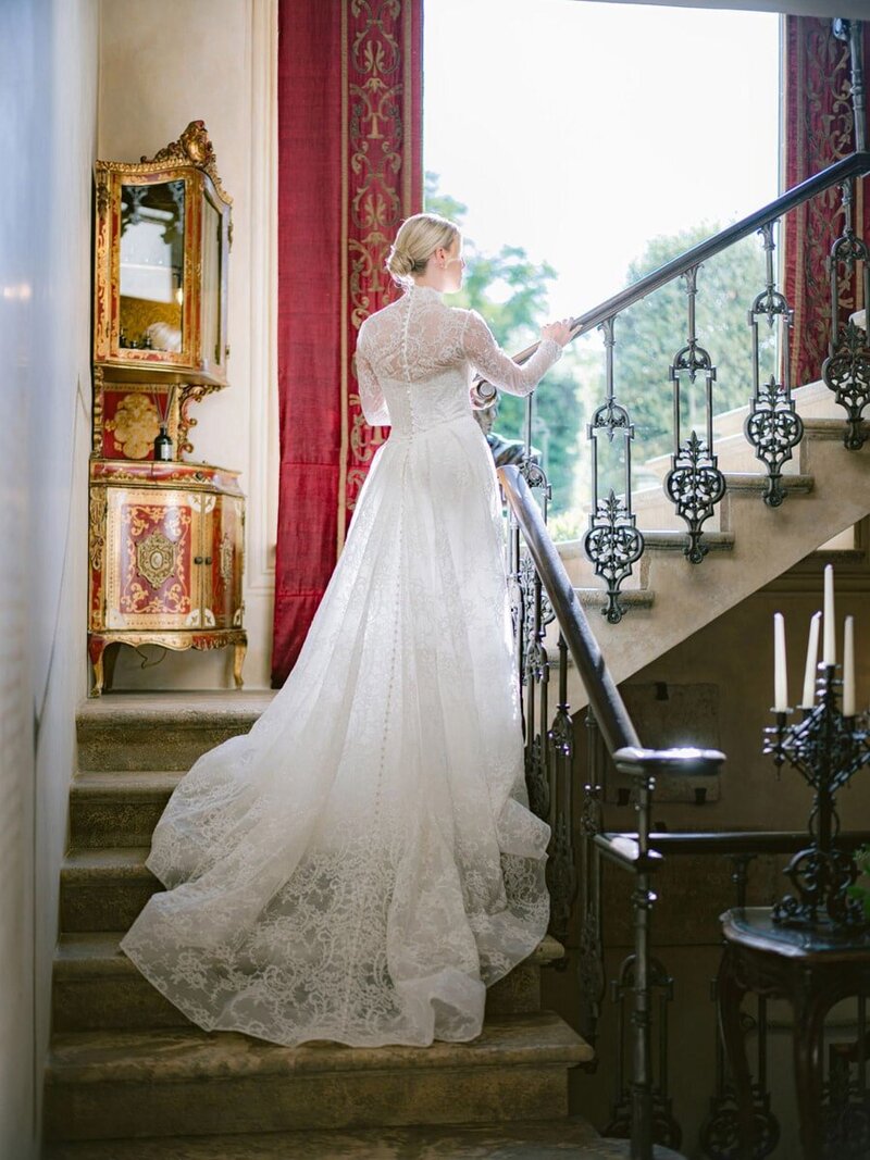 Bride on old staircase during a wedding at Borgo Santo Pietro