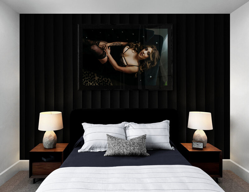 Image of a bedroom with a framed image of a women during her boudoir photography session with Kerry Callahan boudoir