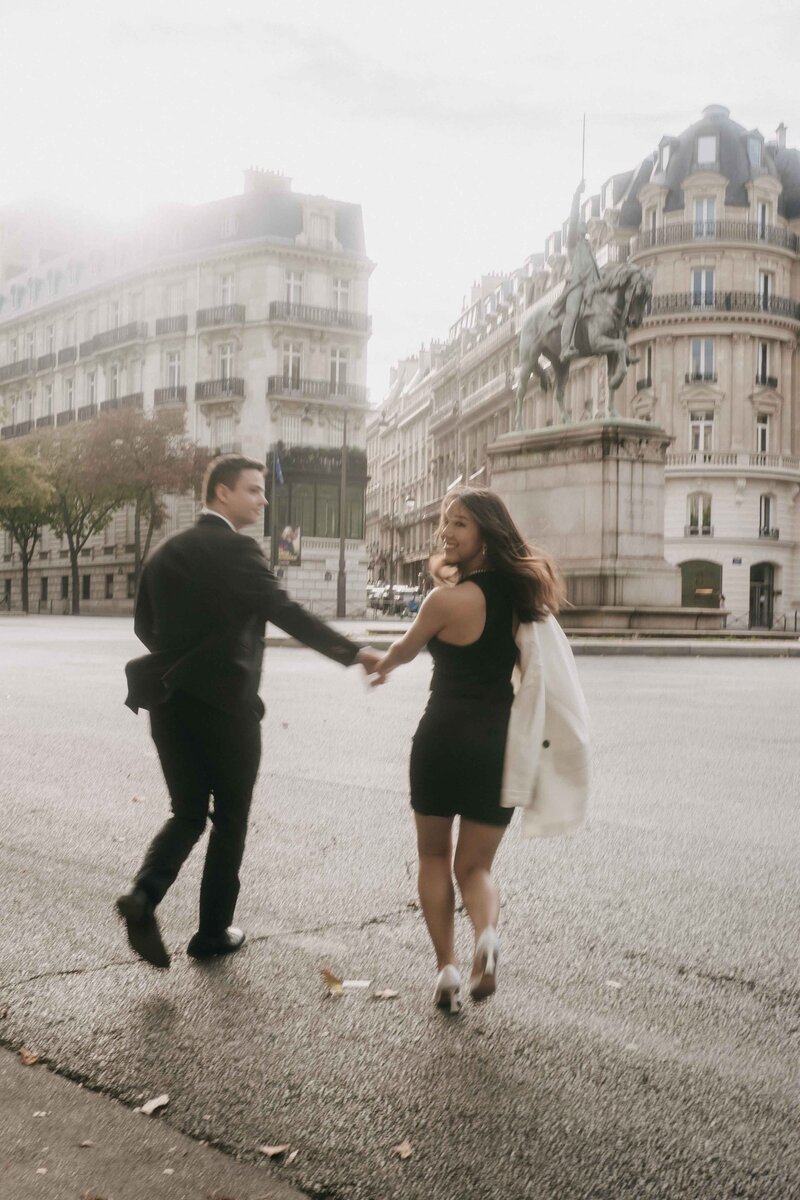 Elegant engagement portraits in Palais Royal garden in Paris