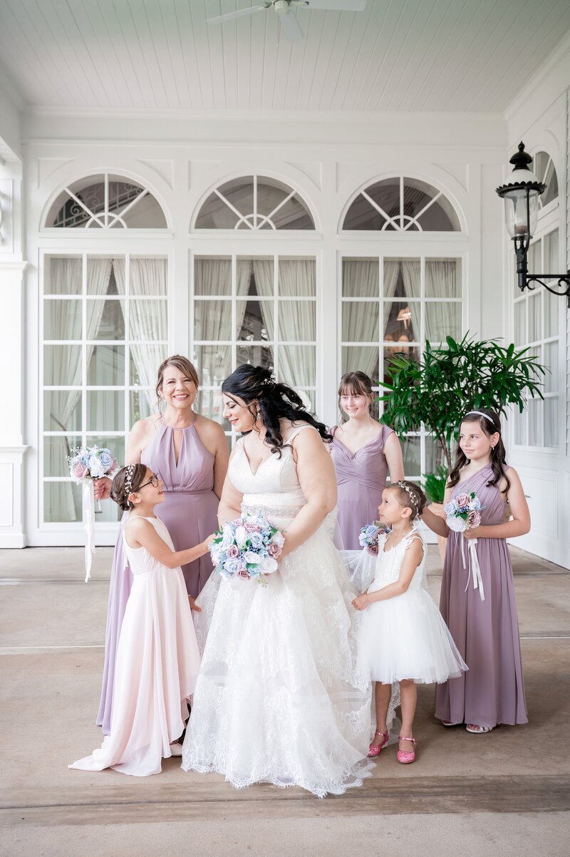 bride with her bridesmaids and flower girls