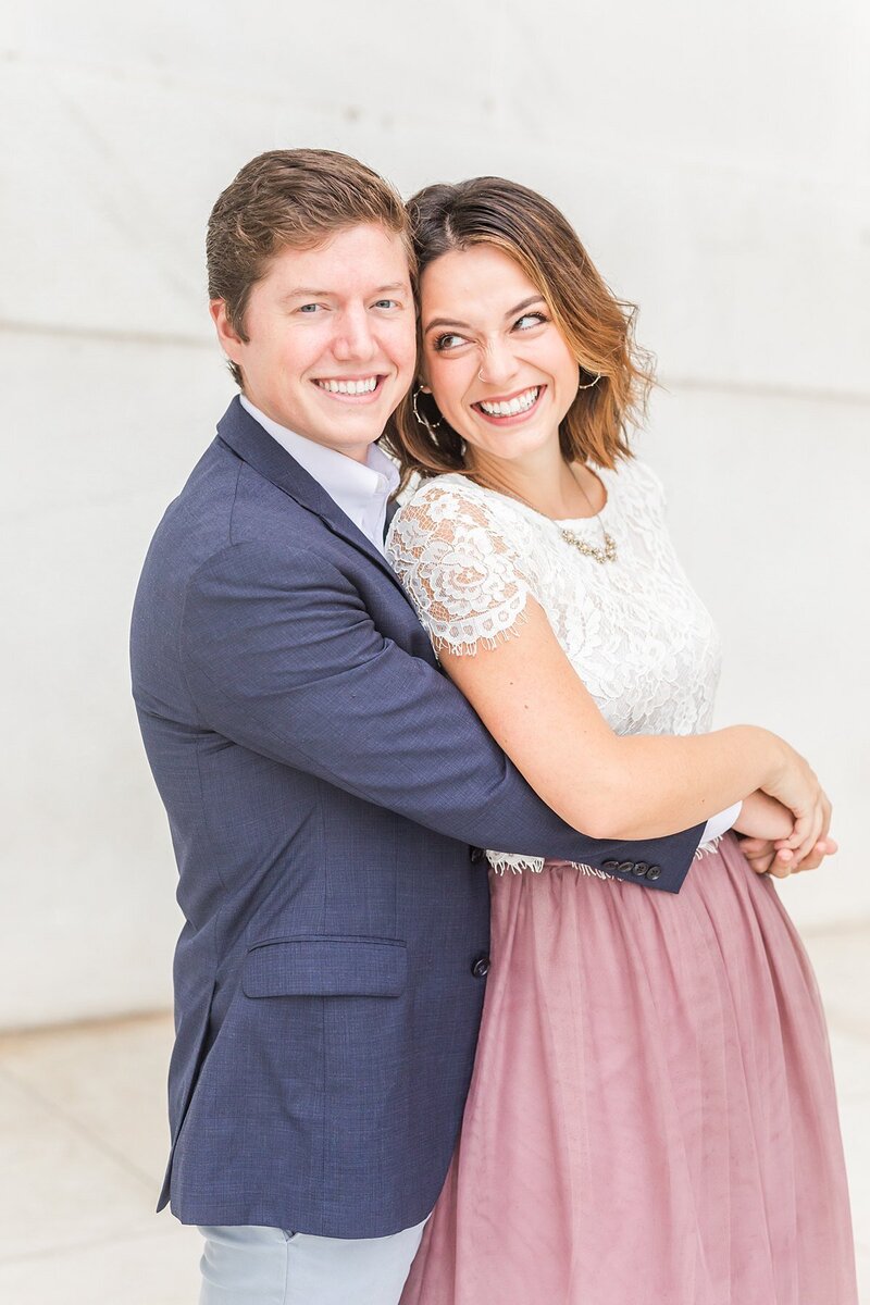 Bride and groom walk up memorial steps at their DC wedding