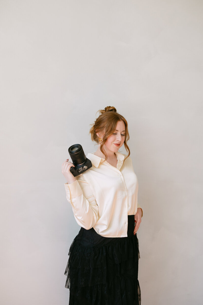wichita wedding photographer and senior photographer ashley cole poses for branding photos