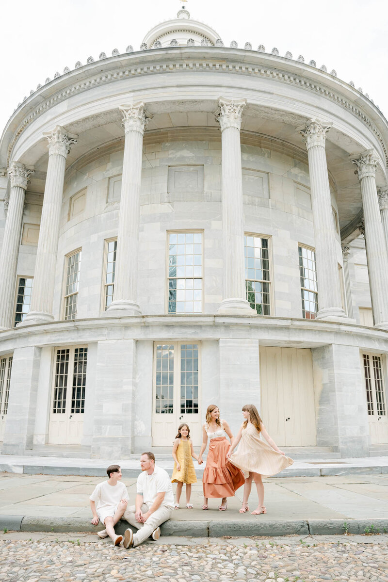 Family of five plays on the bed of their Philly home
