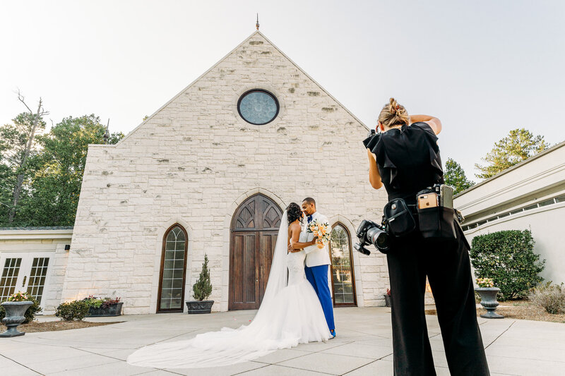 Wedding Photographer in Atlanta walking a groom to his First Look at Ashton Gardens