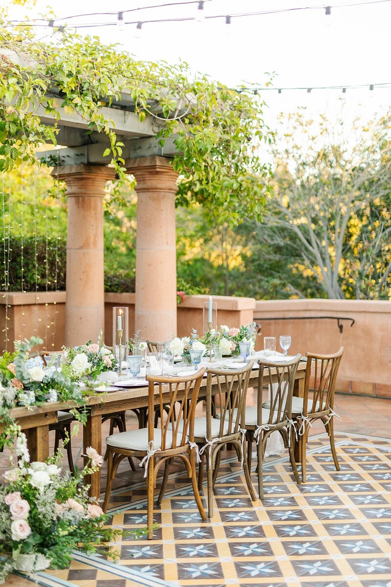Reception tables with floral decor at Rancho Valencia in Rancho Sante Fe in California.