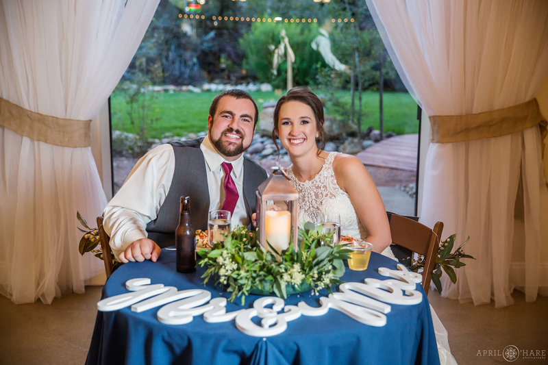 Cute couple at their sweetheart table at Church Ranch Event Center