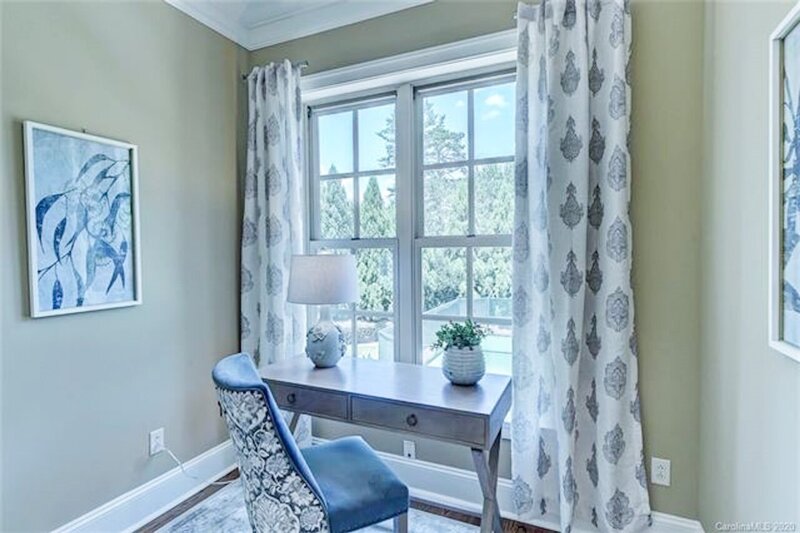 blue and white home office with blue velvet dining chair
