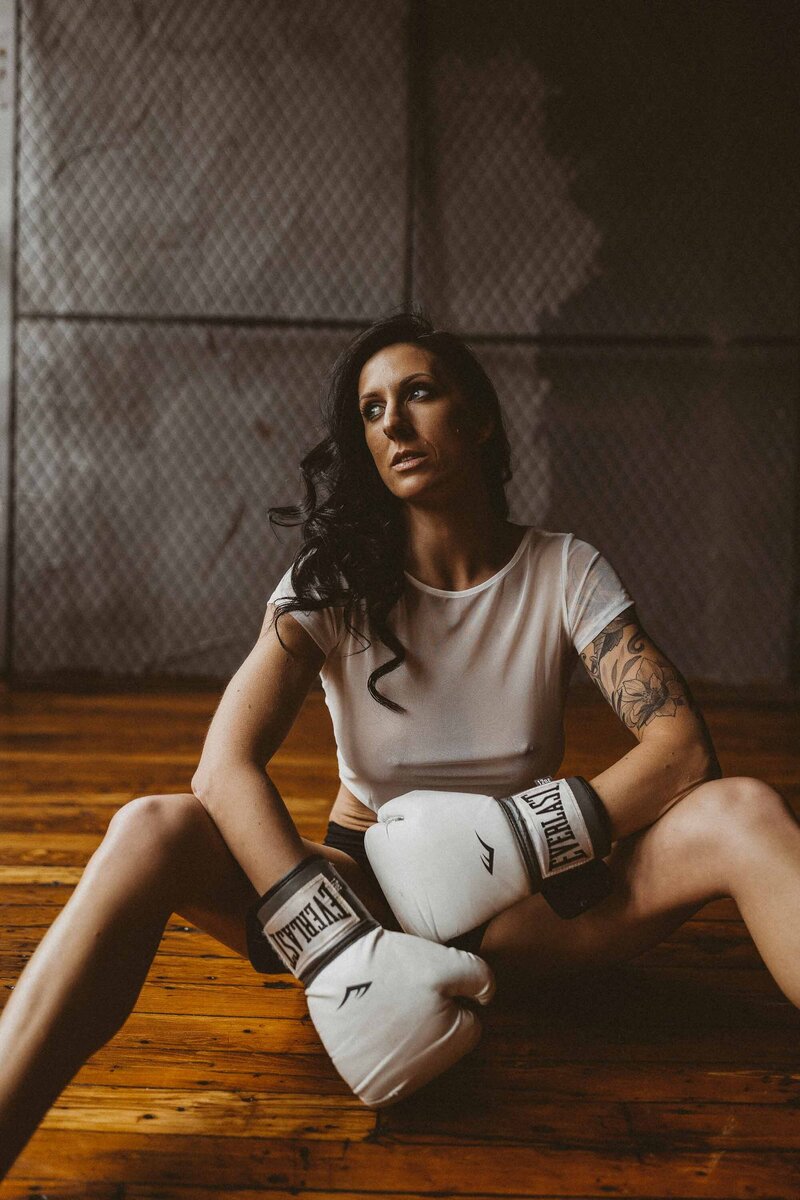fit woman wearing boxing gloves