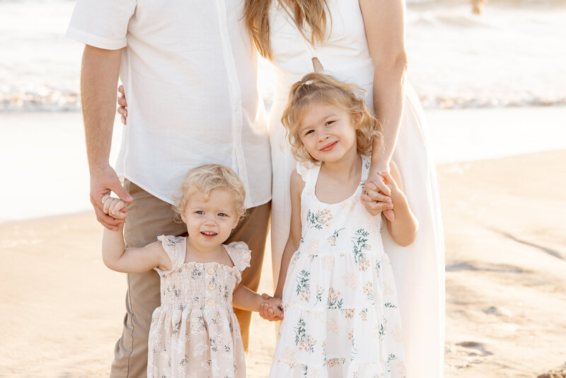 family smiling together during photo session in san diego by experienced family photographer mattie taylor