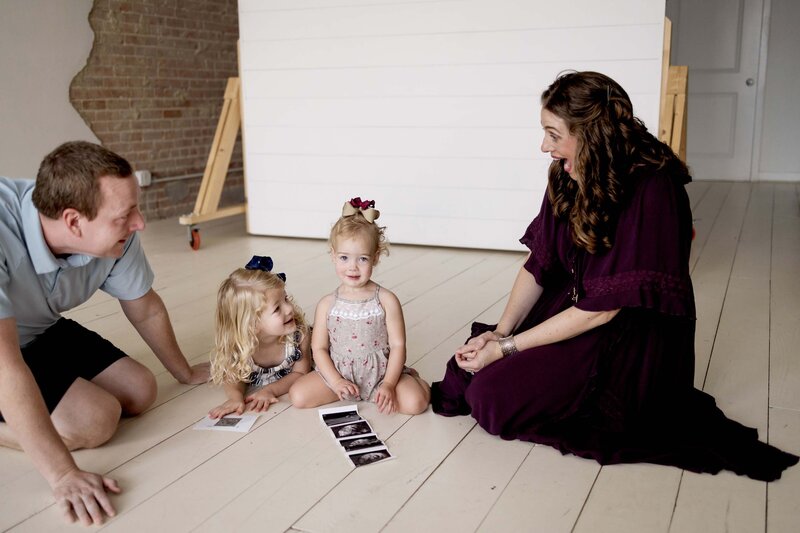 A mom and dad share with their children that a new sibling is on the way.