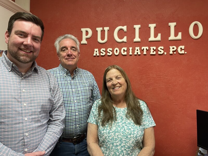 Picture here are Mike Pucillo (middle), P.J. Pucillo, and Janet.