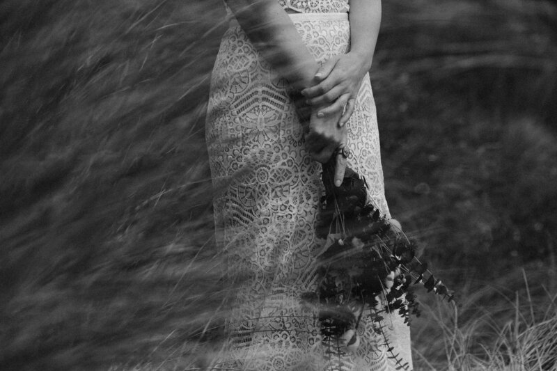 black and white image bride in tall grass