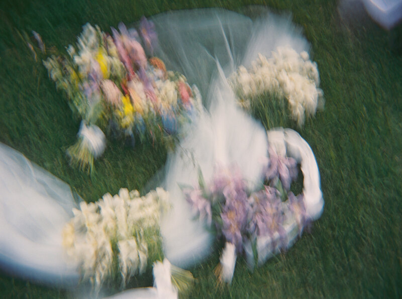 Bouquets  in the field at Brush Creek Ranch Wedding