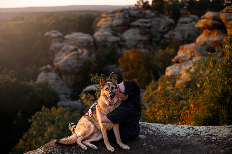German Shepherd and Joanna from Paddle Paws LLC are sitting on the ledge of the Garden of the Gods in Herod, Illinois. Work by Duluth-based pet photographer Joanna of Paddle Paws Photography.