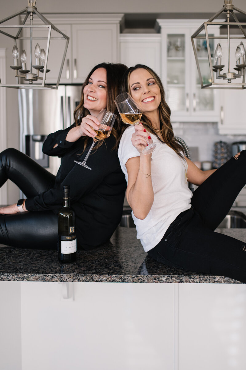 Sisters Lana and Laura enjoying wine on counter