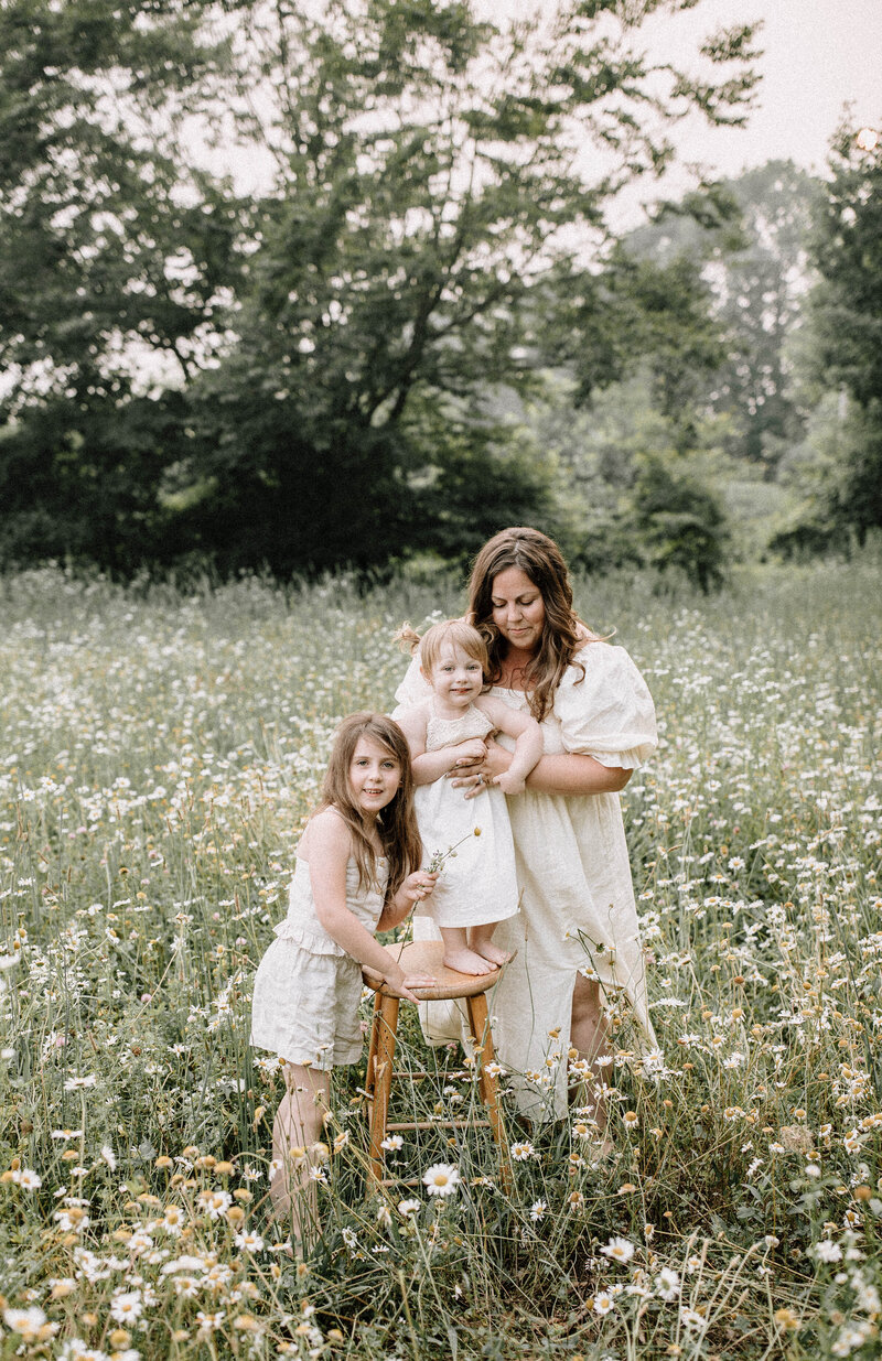 Mom and girls standing in Daisy Field