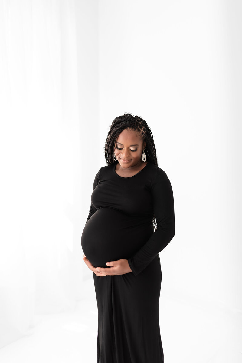 Studio maternity photography in St. Louis, capturing classic and refined pregnancy portraits.
