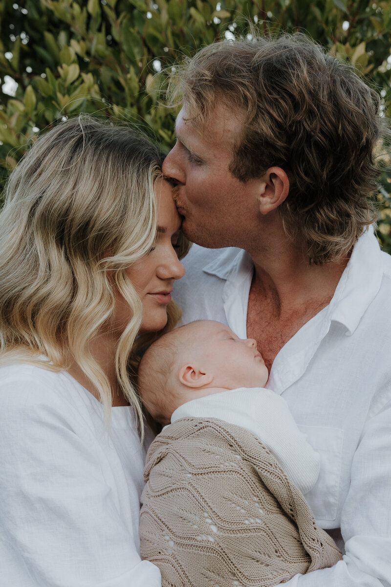 Quartermaine family of four in bed