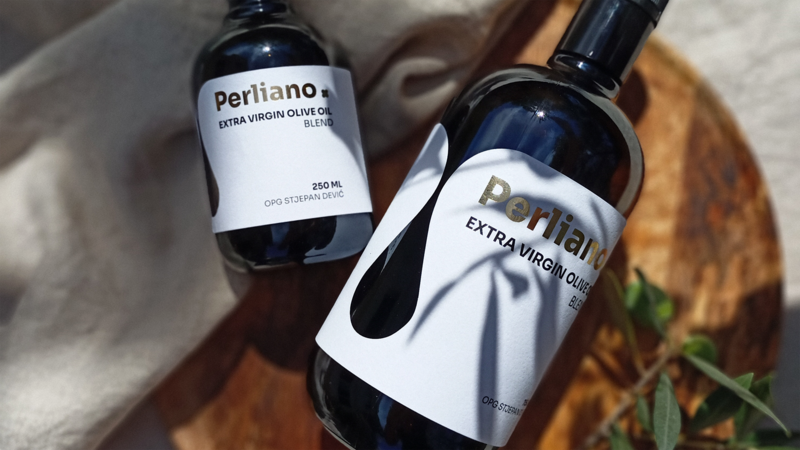 Elegant olive oil label design featuring gold foil printing and die cut