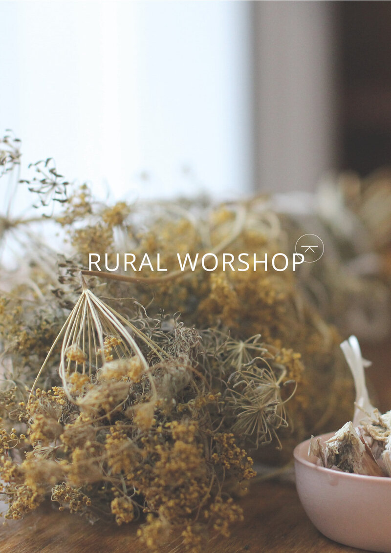Rural Workshop minimal logo design with  brand icon in milk white overlaid on photograph of foraged produce.