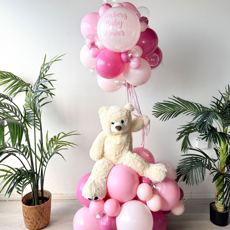 pink balloons and teddy bear by The Party Pond