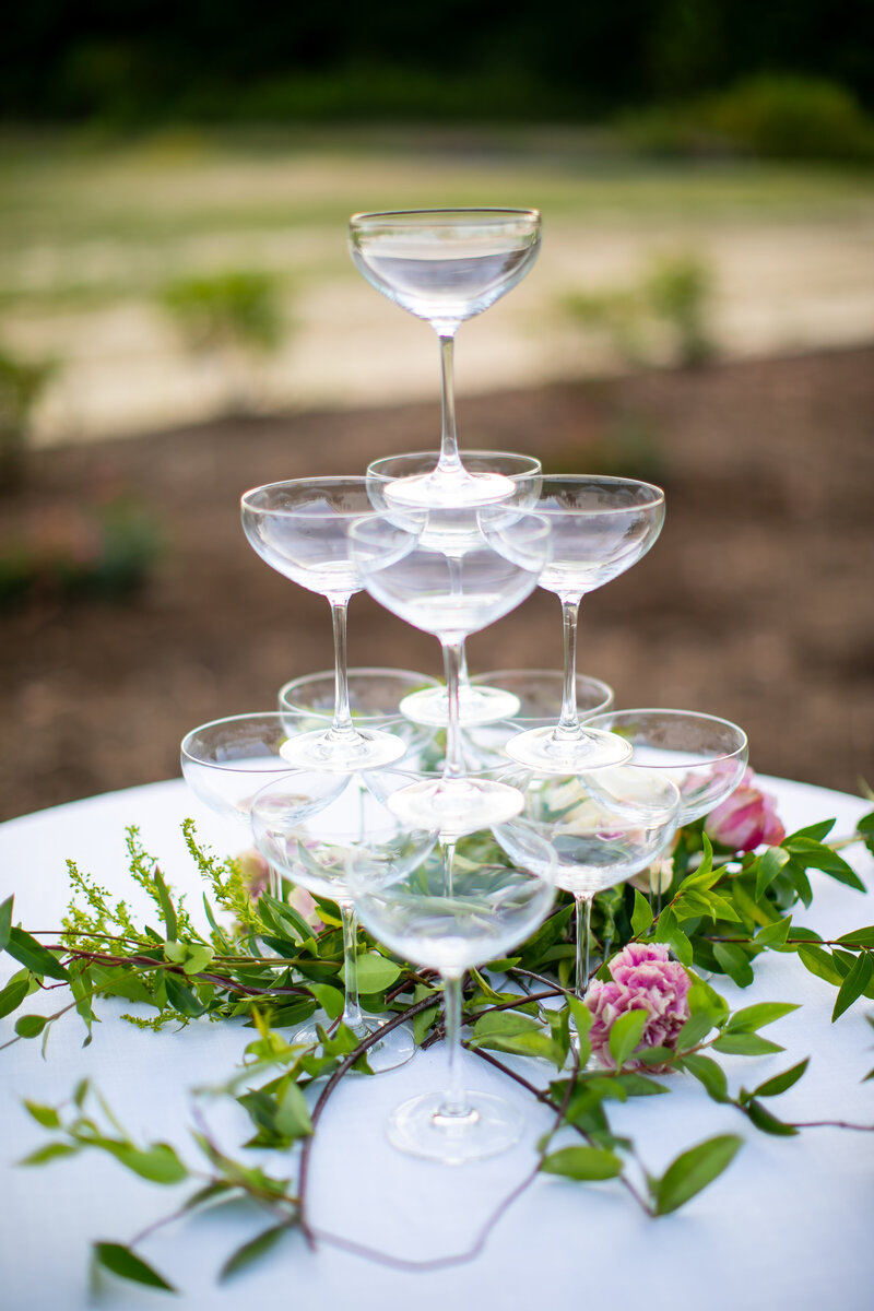 Champagne glasses stacked on table