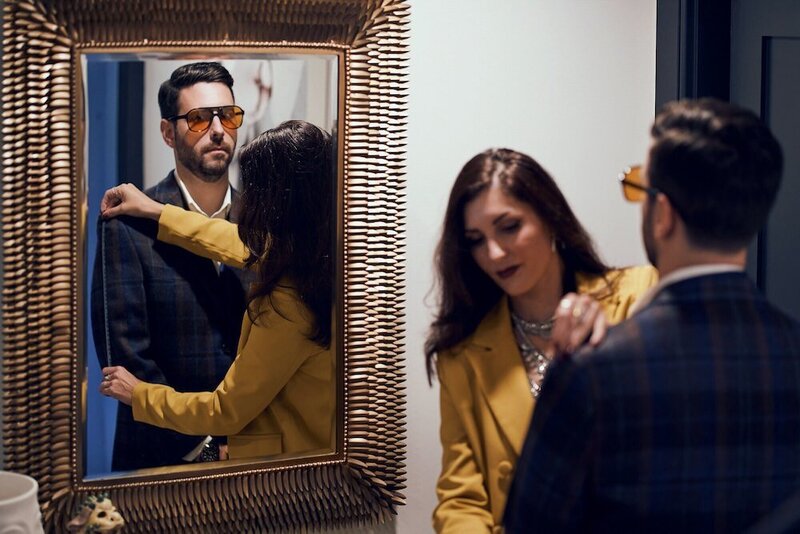 Boston wardrobe stylist measuring arm on a men's suit