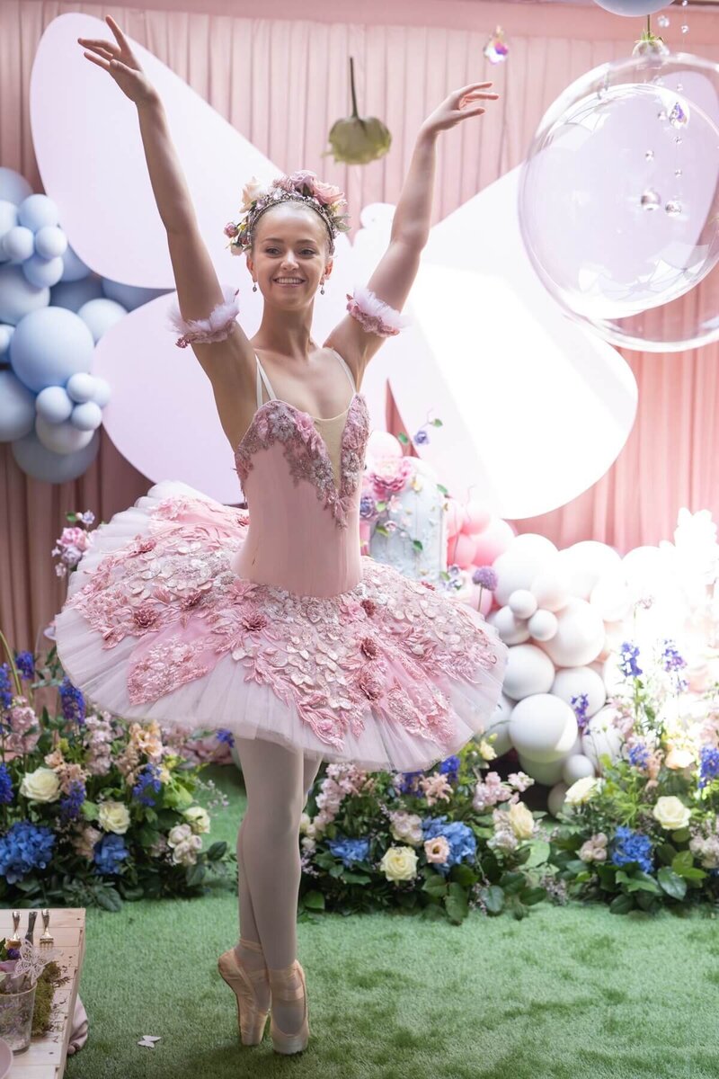 Kids party pink ballerina with balloon decorations and luxury flower arrangements