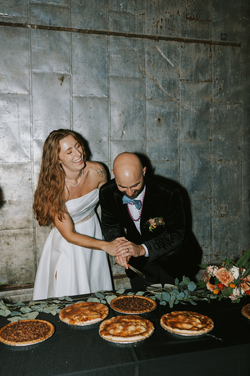 bride and groom holding hands
