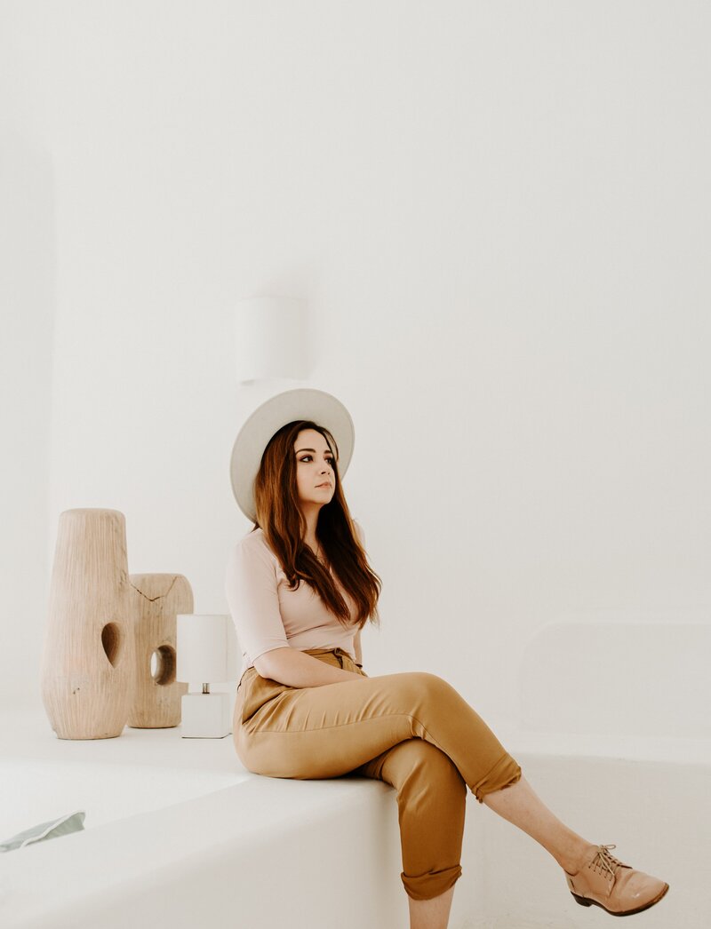 girl wearing hat looking off camera