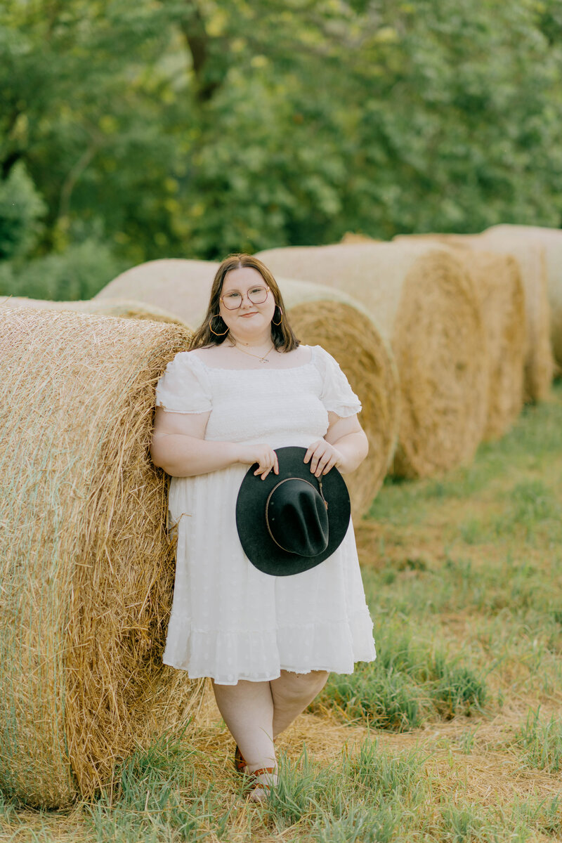 Faith casually poses for her senior portraits in Harrisonburg.