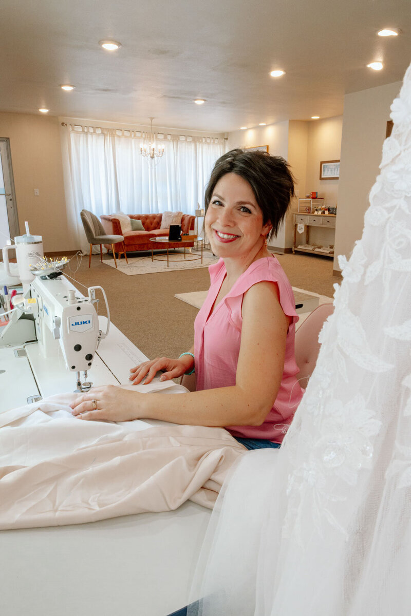 Photo of Nadine, sewing, the owner of Sweet Francis Sewing Co