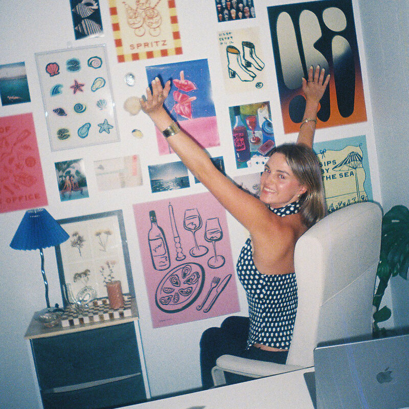Hannah with posters in office
